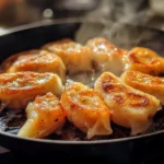Crispy pan-fried rice paper dumplings in skillet