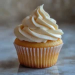 Dairy free frosting recipe piped onto vanilla cupcake